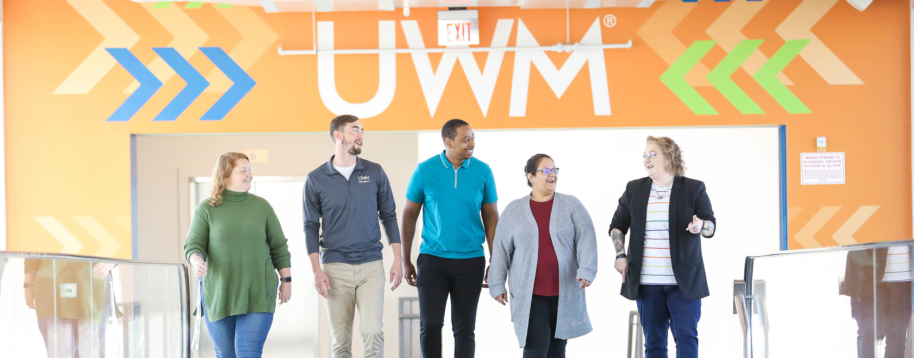 team members walking across bridge