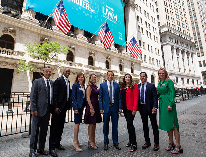 The UWM executives standing in front of Wall Street