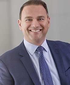 Alex Elezaj, CSO of UWM, in profile view