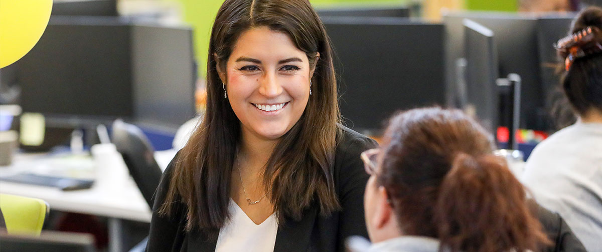 UWM team member, Maria Subashi, smiling at work