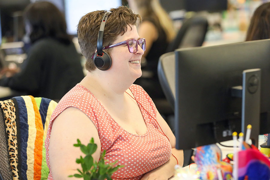 A happy UWM team member with the Client Experience team