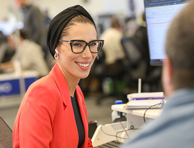 Happy young professional at their desk