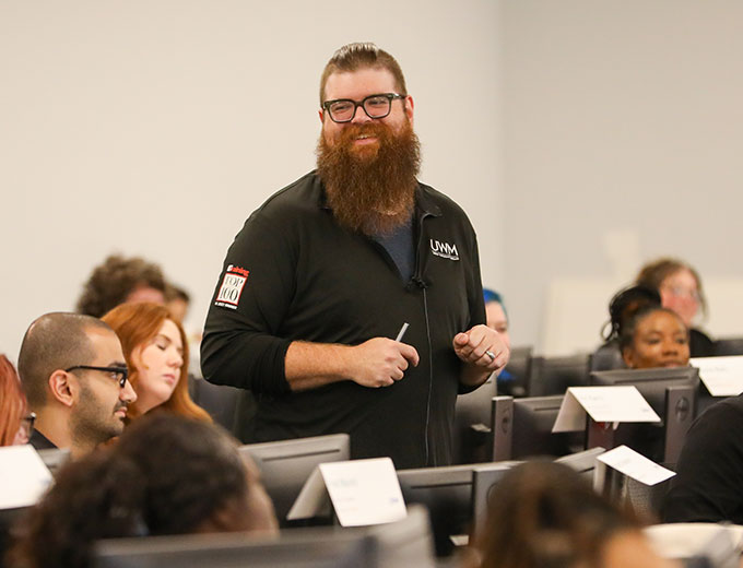 A happy professional taking a question from a training group